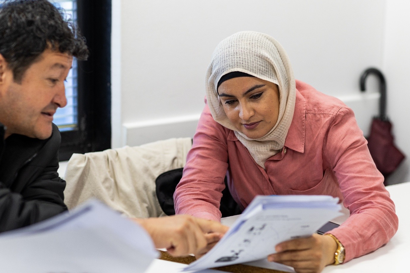 Lady and man looking at documents together